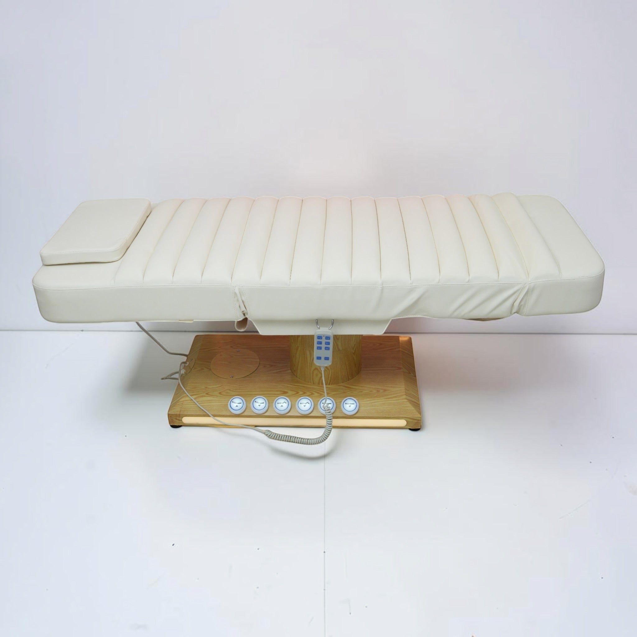 MK BEAUTY BED luxury electric treatment bed in cream PU leather with a wooden base and handheld remote control