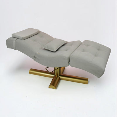 MK BEAUTY BED All in One curved treatment bed in grey with a gold X-cross base for salon and spa use.