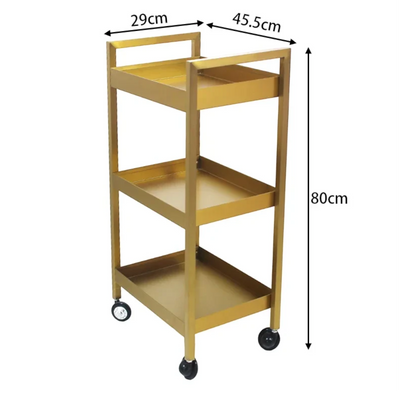 MK BEAUTY BED gold carbon steel beauty trolley with three shelves and smooth-rolling castors for salon storage.