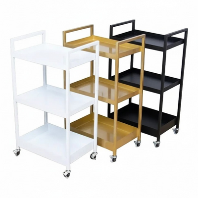 MK BEAUTY BED three-tier professional salon trolley in white, gold, and black carbon steel with rolling castors.