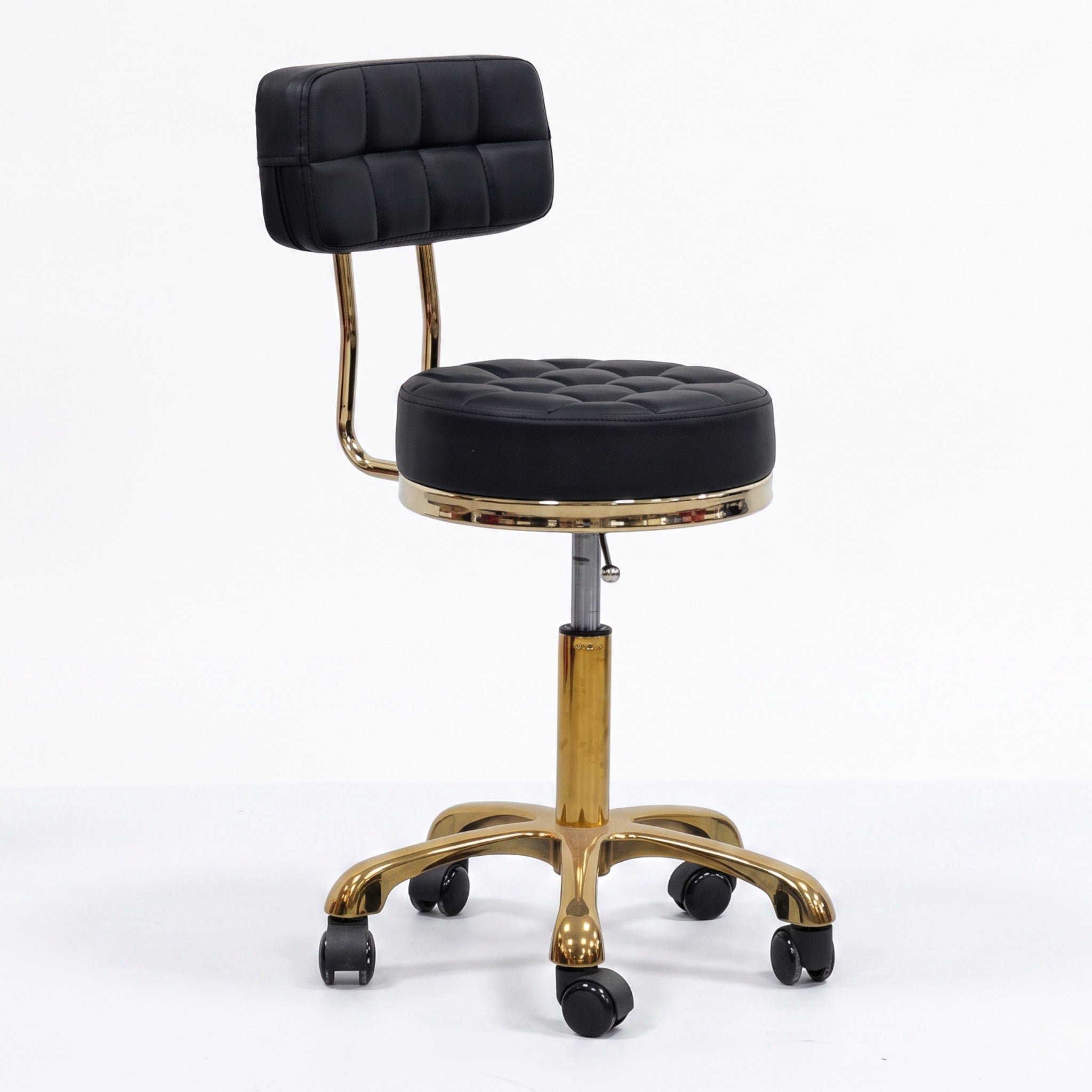 MK BEAUTY BED Waffle Stool in black leather with a quilted seat, gold gas-lift base, and smooth rolling castors.